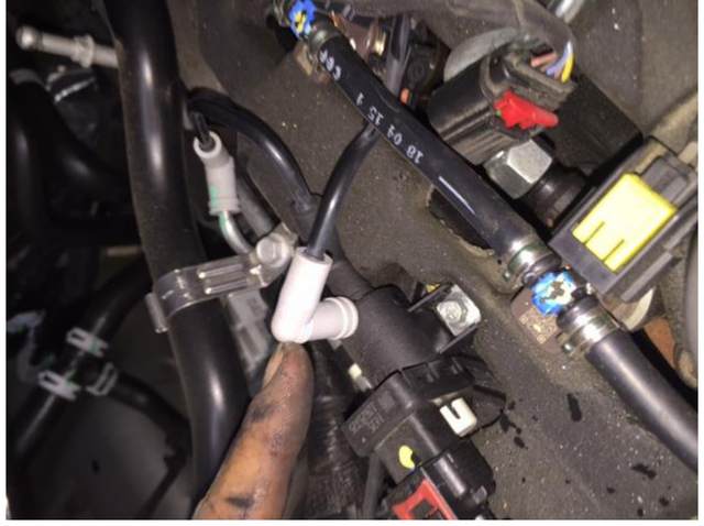 Remove the EGR mixing valve vacuum line and cap the open valve