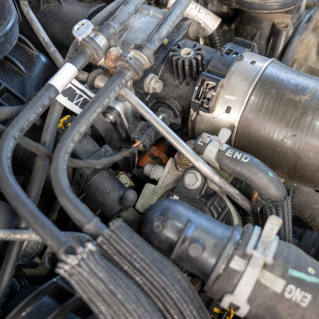 Cool down, disconnect the battery, drain the coolant, and disconnect the EGR