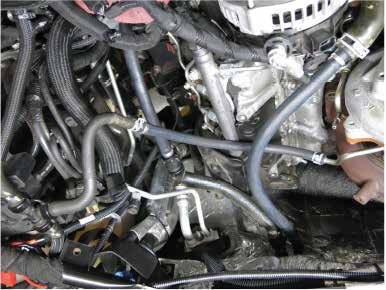 Fit the 15" long 3/8" coolant line to the upper turbo line