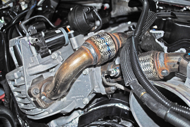 Disconnect the EGR temperature sensor and remove the short EGR pipe