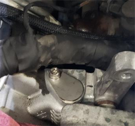 Remove the small black tube and fit the blocker plate