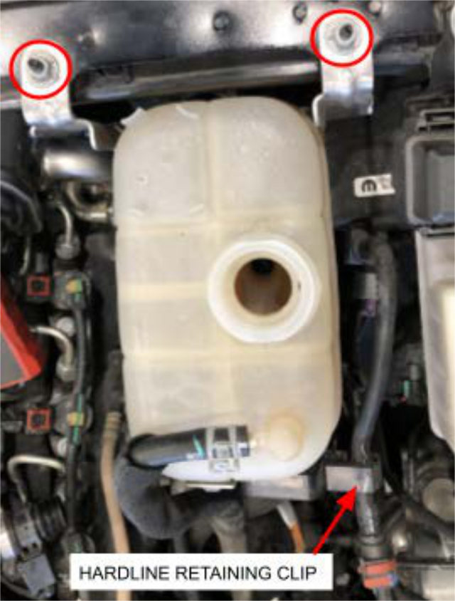 Move the coolant reservoir aside