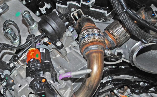 Disconnect the EGR temperature sensor and remove the short EGR pipe
