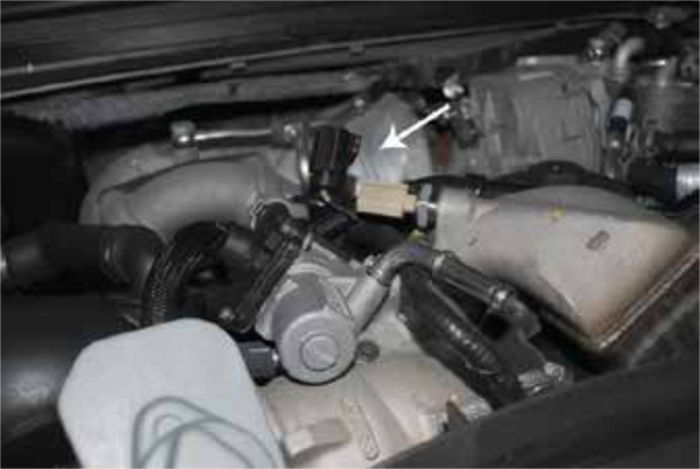Disconnect the electrical connector on top of the vertical EGR cooler