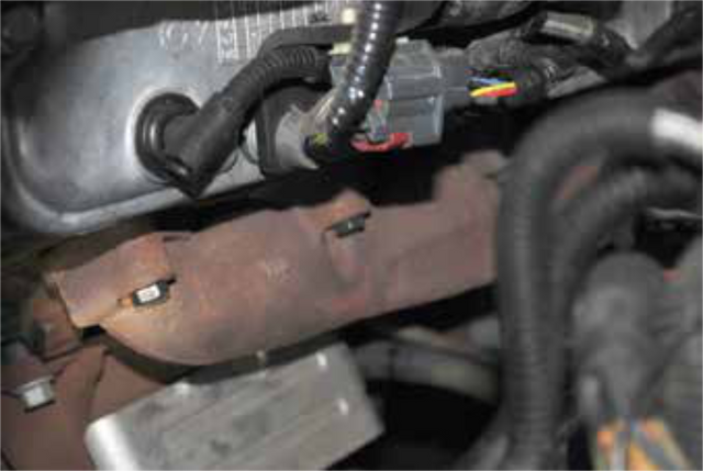 Install the four replacement manifold bolts