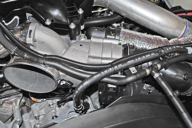 Unplug the harnesses on top of the EGR cooler and cap the vacuum line