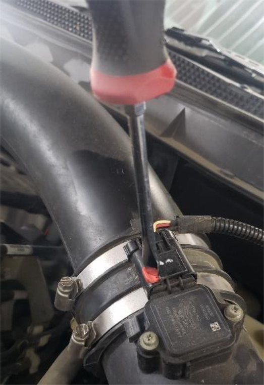 Unplug the MAF connector on the intake hose