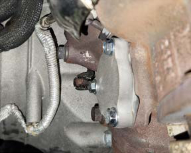 Install the exhaust blocker plate