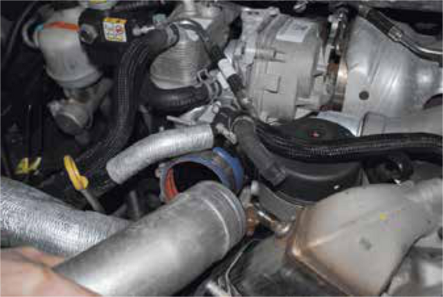 Separate the driver side intercooler tube from its rubber boot