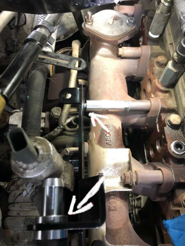 Attach the black steel bracket to the threaded collar and hose adapter
