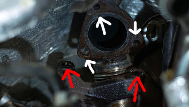 Remove the up-pipe to EGR cooler bolts
