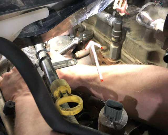 Press the aluminium hose adapter into the coolant line