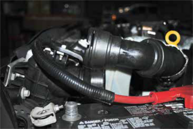 Remove the 3/8" hose that runs to the degas bottle