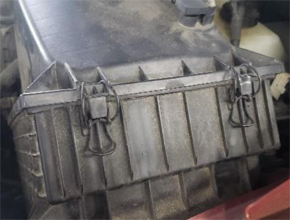 Open the housing and remove the filter