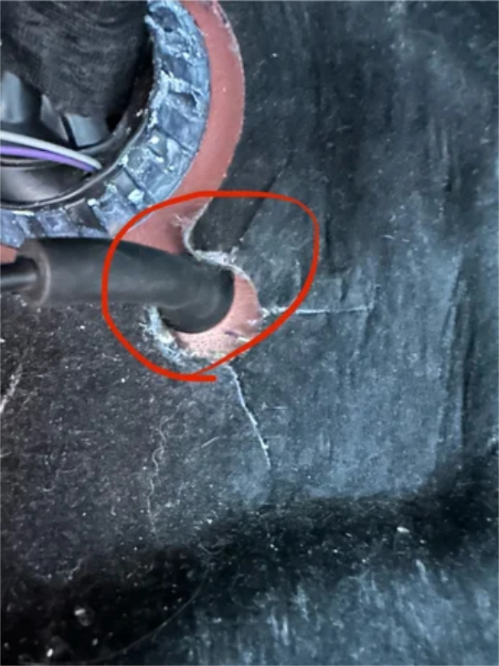 Locate the hood release cable where it passes through the firewall