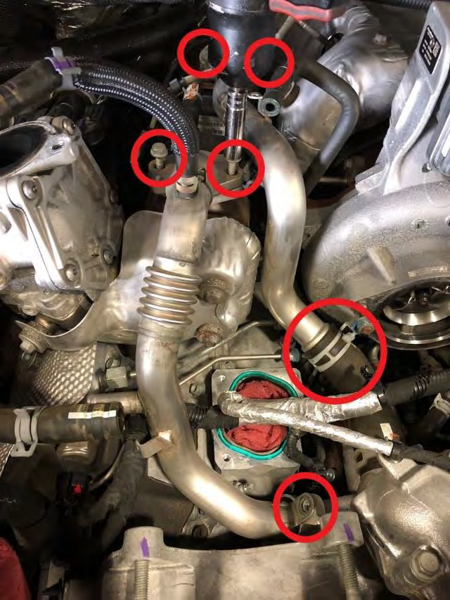 Remove the two large steel coolant pipes feeding the EGR cooler