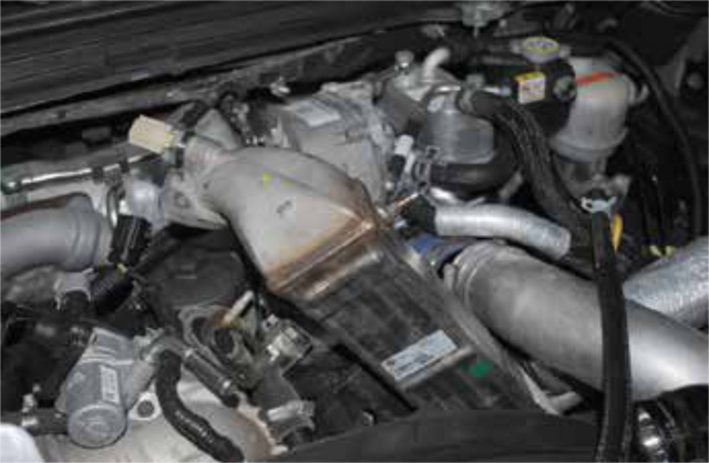 Pull the vertical EGR cooler up and out
