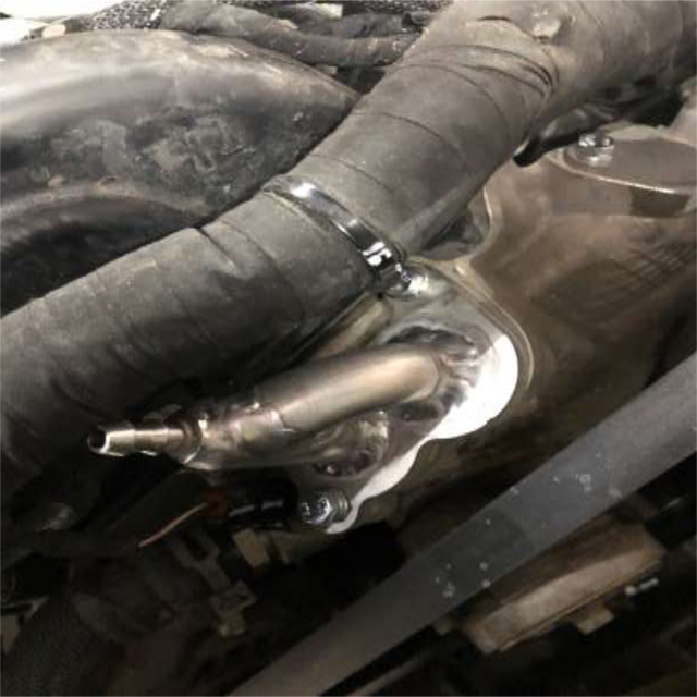 Bolt the charge tube to the manifold and lock the clamps