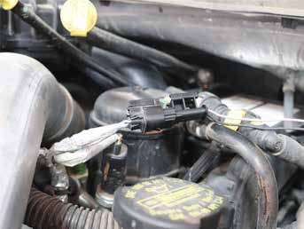 Connect the plug to the factory harness