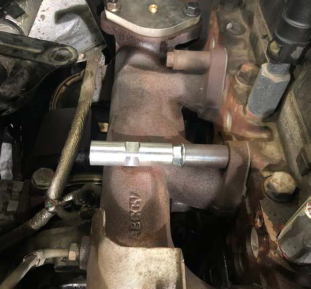 Wrap the 1/2" NPT plug in Teflon tape