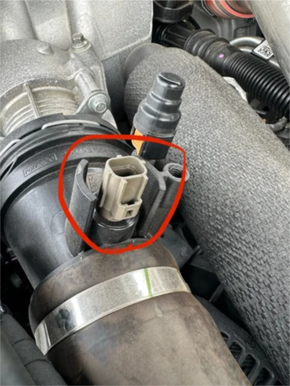 Plug the switch connector into the truck harness and tape off the factory sensor connector