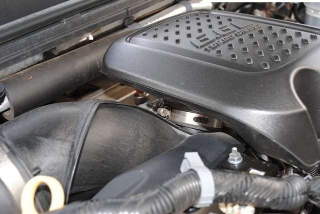 Remove the resonator box on top of the engine