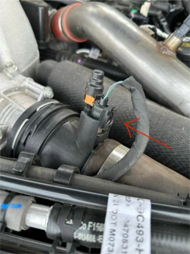 Plug the switch connector into the truck harness and tape off the factory sensor connector