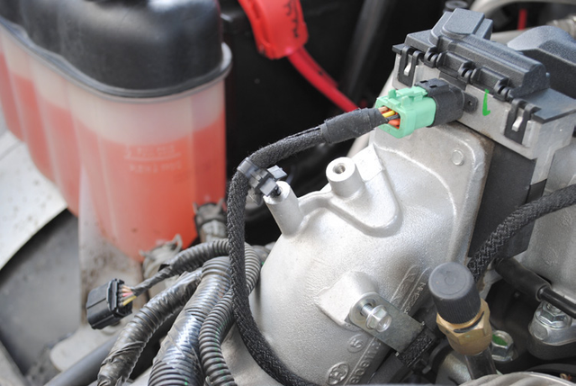 Disconnect the connector on the front of the heater grid