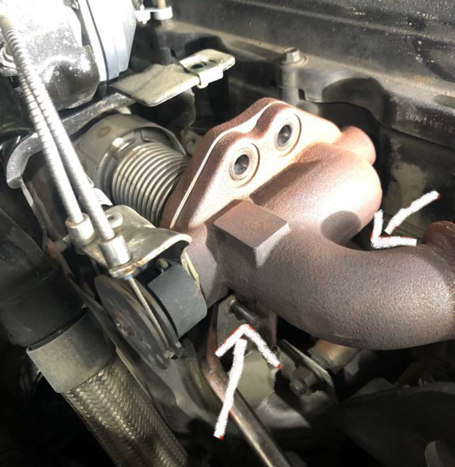 Remove the heat shield bolts under the cooler