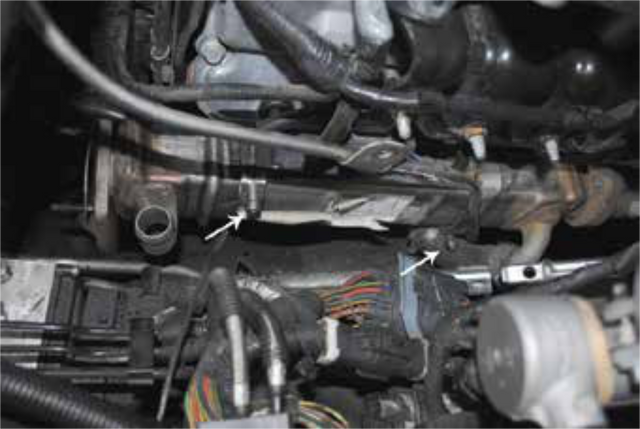 Release the mounting clamps on the lower EGR cooler