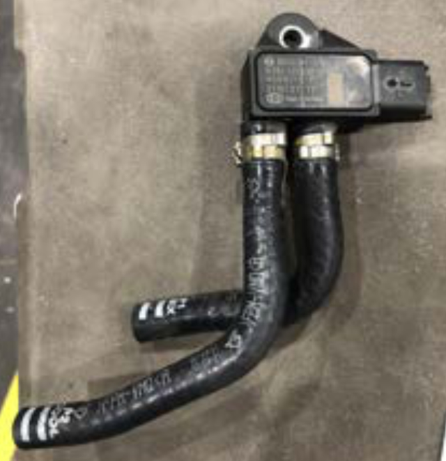 Remove the remaining coolant hoses, the spacer bracket and the actuator