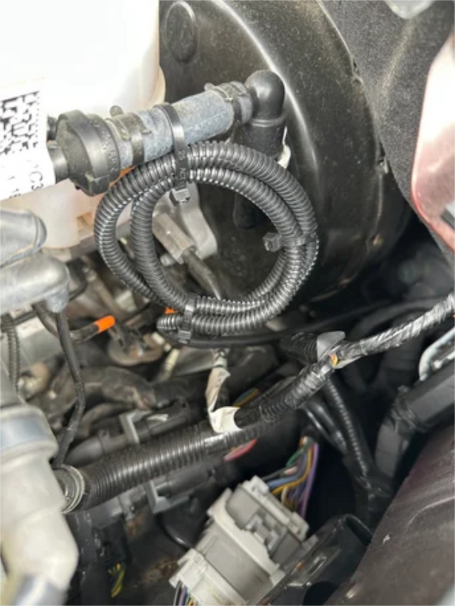 Zip-tie the conduit and switch wiring under the hood