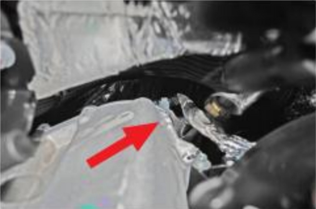 Remove the nut retaining the EBP hard line to the back of the cooler