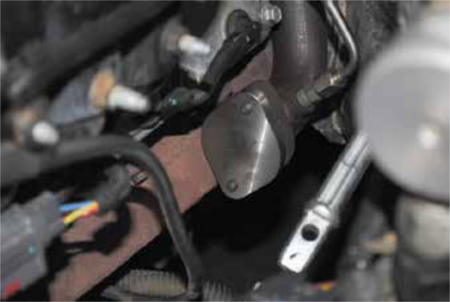 Install the exhaust block off plate