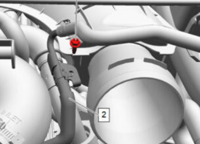 Remove the bolt from the coolant line support bracket