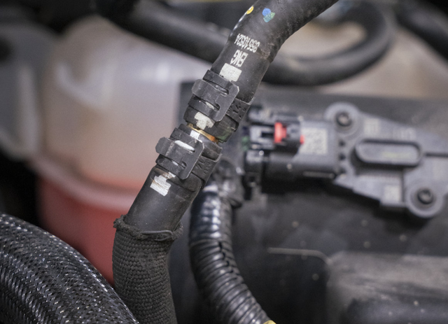 Reroute the EGR crossover coolant line