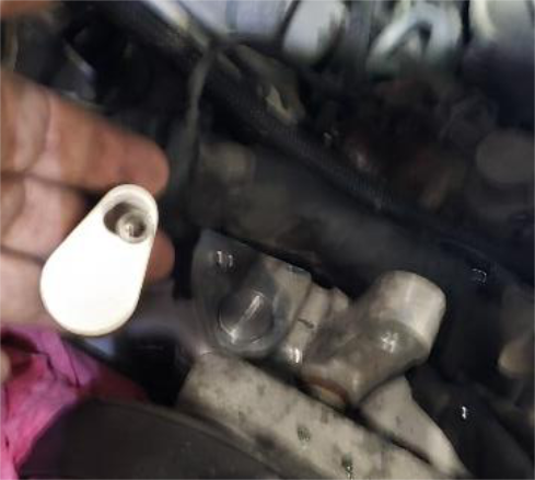 Remove the small black tube and fit the blocker plate