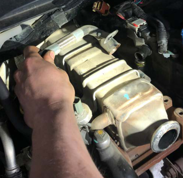 Pull the coolant line out of the cooler and pry the coolant hose off