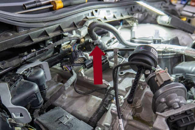 Disconnect the quick-connect coolant line from the metal standpipe